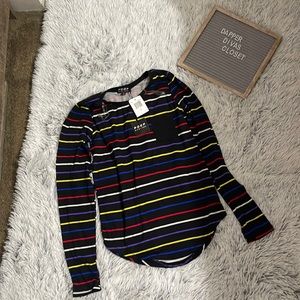 Long sleeve black top with multi-color stripes and a small pocket